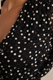 Mela Black And White Polka Dot Plunge Neck Mini Dress With Bell Sleeves And Sash Detail
